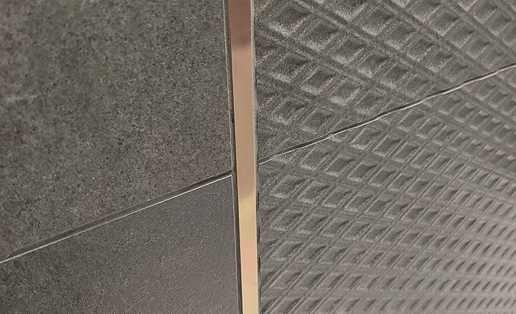 Copper V2 tile texture in a luxurious gold-orange shade.
