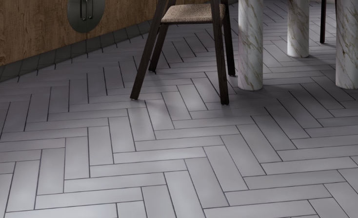 A kitchen with beautiful floor tiles, featuring a pattern of geometric designs, adding style and charm to the space.